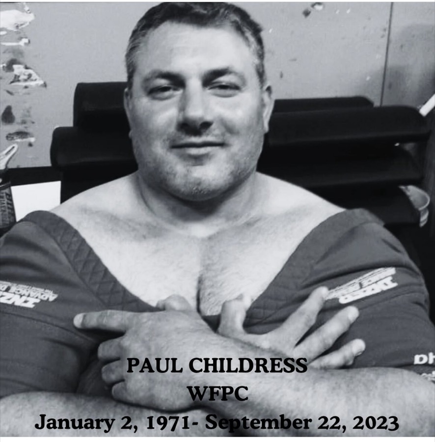 Paul Childress in powerlifting gear. The photograph is captioned: Paul Childress, WFPC, January 2, 1971 to September 22, 2023.